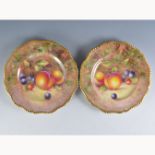 A pair of Royal Worcester plates, shaped rims, painted numbers 312 and C55,