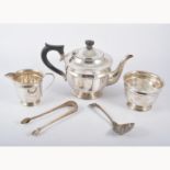 A three-piece silver teaset by Viners, Sheffield 1938, plain circular form,