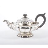 Continental white metal teapot, marks partially erased, mid 19th Century, of lobed circular form,