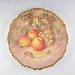 A Royal Worcester plate, wavy rim, painted number C55, painted with fuit by Harry Ayrton, signed,