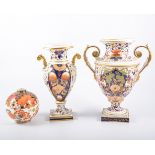 Derby porcelain two-handled urn shape vase, circa 1830, decorated in Imari colours, (old repairs),