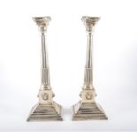 Pair of silver Corinthian column table candlesticks, Britton Gould & Co.