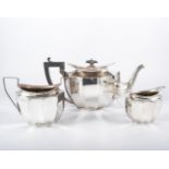 A silver three piece tea set, by F H Adams & Co, Birmingham 1923, fluted form,