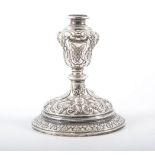 Continental white metal candlestick, possibly German, probably late 19th Century, of squat form,