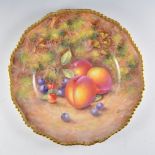 A Royal Worcester plate, painted number C55, painted with fuit by John Freeman, signed,