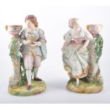 A pair of 19th Century French bisque porcelain candlesticks, by Vion & Baury,