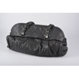 Chanel - A large black leather Lady Braid handbag,