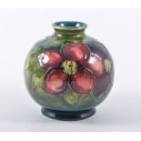 Walter Moorcroft 'Clematis' globe vase, circa 1950, 10cm high.