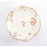 Five Continental porcelain dessert stands, floral design on a cream ground,