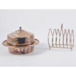 Oval plated platter, oval pierced galleried tray, toast rack, muffin dish, and two circular trays.