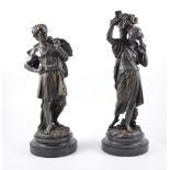 A pair of cast bronze figures, depicting male and female harvesters, after Boyer,