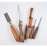 Collection of hand tools, including planes, chisels, etc.