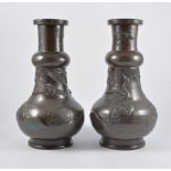 Pair of Chinese bronze vases, cast decoration of storks, 30cm.