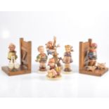 Pair of Gobel bookends, mounted with girl and geese, and boy and pigs,
