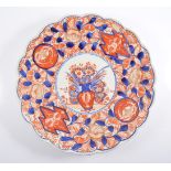 An Imari charger, lobed outlines, floral decoration in a traditional palette,