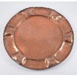 Circular Arts and Crafts beaten copper tray, diameter 40cm.