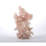 An Eastern carved rose quartz figure of a girl with a fan, 27cm.