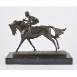 Reproduction bronze horse and jockey, on a rectangular black marble plinth, unsigned, height 24cm.