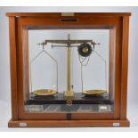 Scientific scales by Griffin & George Ltd, glazed case, W47cm.