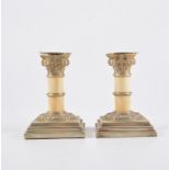 Pair of 19th Century metal and ivory dwarf corinthian column candlesticks, 11cm.