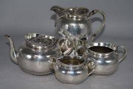 A Victorian silver three-piece tea service, London 1870, George Fox and a similar plated hot water