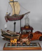 A model Stephenson's Rocket, painted metal ship balance toy, a wooden boat & car & two glass