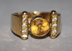 An 18ct gold yellow sapphire & diamond set dress ring, size J.