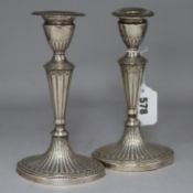 A pair of late Victorian fluted silver dwarf candlesticks, William Hutton & Sons, London 1897, 7.