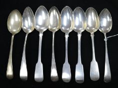 Eight silver fiddle and Old English pattern table spoons, George III and later