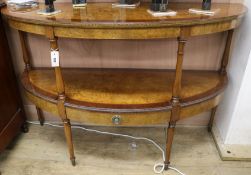 An inlaid burr walnut bowfront two tier side table, W.135cm