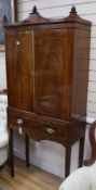 A Regency style mahogany cabinet on stand, W.82cm H.190cm