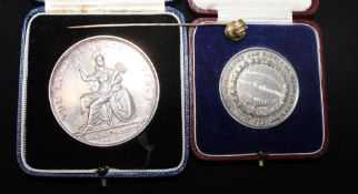 Two Irish silver medallions and a gold stick pin.