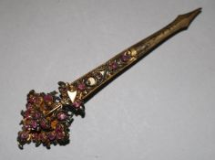 A gilt metal and pink stone set brooch, 4in.