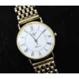 A gentleman's 9ct gold Longines quartz wrist watch on an associated 9ct gold bracelet.