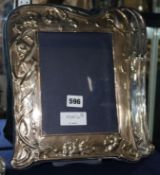 A set of three 1980's Art Nouveau style silver mounted photograph frames, 12.5in.