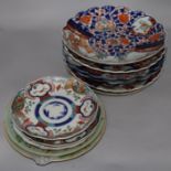 Five Imari chargers with scalloped edges, two similar plates, three Canton plates and a famille rose