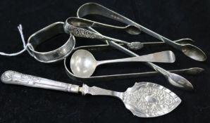 Small silver flatware and a napkin ring.