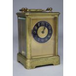 A French brass cased eight day carriage timepiece, 4.75in.
