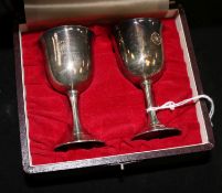 A cased pair of Japanese silver saki cups (a gift to the vendor upon the state visit of Emperor