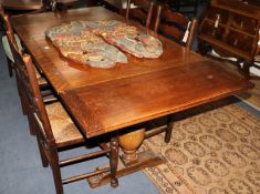 A 1920's oak draw leaf dining table, extends 182 x 89cm