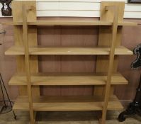 A set of Marks & Spencers oak wall shelves, W.148cm