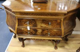 A 1930's seaweed marquetry and walnut bombe sideboard, W.124cm H.85cm