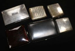 Silver cigarette box (a.f), three silver engine-turned cigarette cases, a silver gilt-mounted faux