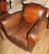 A 1930's French brown leather armchair