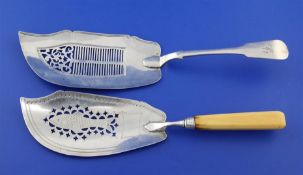 A George III ivory handled silver fish slice and an early Victorian Scottish silver fish slice, no