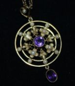 A 15ct Victorian seed pearl and amethyst pendant on a 9ct gold chain, pendant 1.75in.