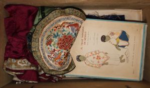 A collection of Chinese embroideries and Eastern clothing and fabrics in a pine box