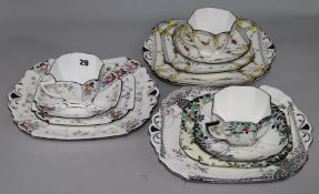 Three Shelley Queen Anne shape teacups, saucers, plates and cake plates