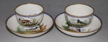 A pair of 'Sevres' tea bowls and saucers
