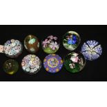 A collection of nine paperweights